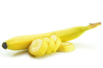 Image showing Ripe yellow banana with sliced bananas