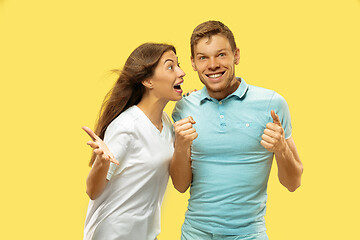 Image showing Beautiful couple isolated on yellow studio background