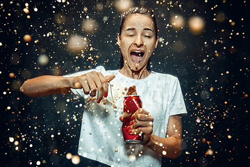 Image showing Woman drinking a cola