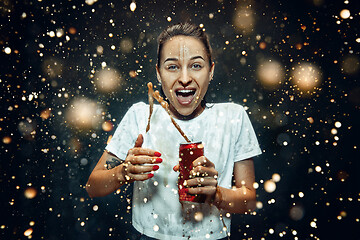 Image showing Woman drinking a cola