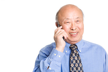 Image showing Senior asian businessman on the phone