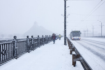 Image showing Pedestrians and Bus during heavy snow storm