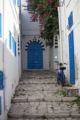 Image showing Narrow street with moped