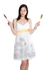 Image showing Beautiful asian woman and lollipops