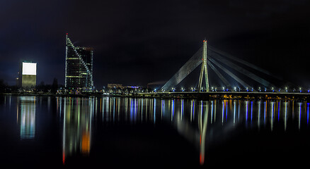 Image showing Riga skyline with skyscrapers and suspension bridge