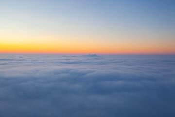Image showing Amazing sunrise above clouds from the top of the mountain 