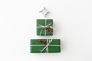 Image showing green christmas gifts and mold in shape of star