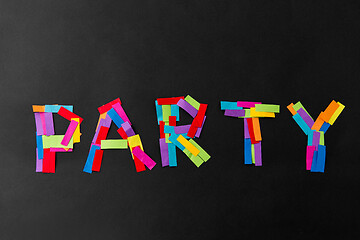 Image showing party word made of multicolored papers on black