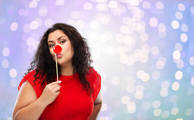 Image showing happy woman with red clown nose posing