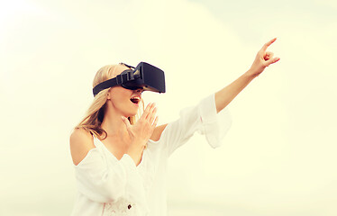 Image showing woman in virtual reality headset pointing finger