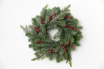 Image showing christmas wreath of fir branches with red berries