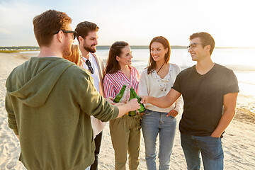 Image showing friends toasting non alcoholic drinks on beach