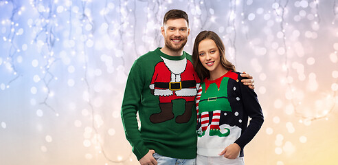 Image showing happy couple at christmas ugly sweater party