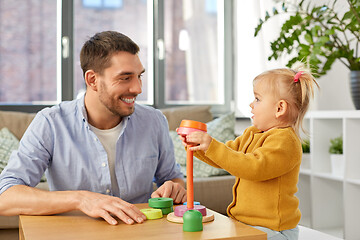 Image showing father playing with little baby daughter at home