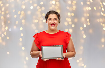 Image showing happy woman in red dress holding tablet computer