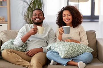 Image showing african american couple drinking coffee at home