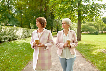 Image showing senior women or friends drinking coffee at park