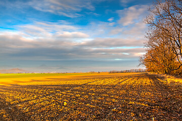 Image showing Autumn plowed field at amazing sunrise. Czech Republic