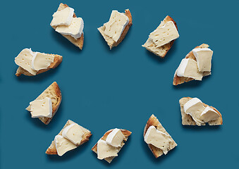 Image showing toasted bread slices with brie cheese