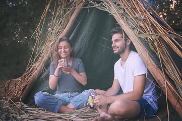 Image showing couple spending time together in straw tent