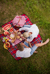 Image showing top view of couple enjoying picnic time