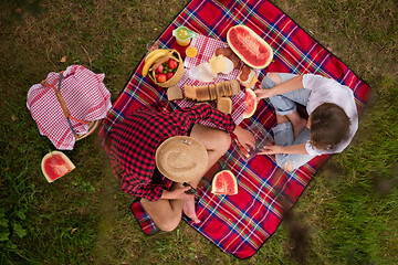 Image showing top view of couple enjoying picnic time