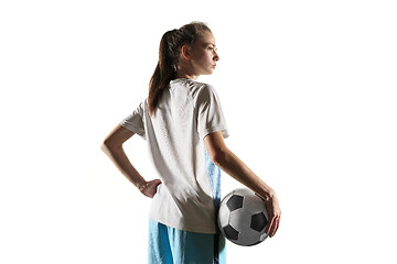 Image showing Female soccer player standing with the ball isolated over white background