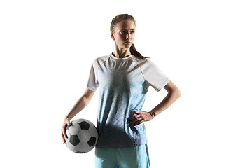 Image showing Female soccer player standing with the ball isolated over white background