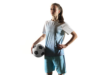 Image showing Female soccer player standing with the ball isolated over white background