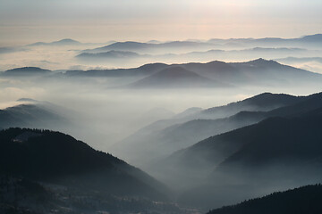 Image showing Mountains and mountains, crest and low clouds