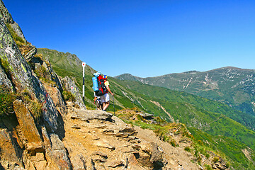 Image showing Hiking teens on mountain trail