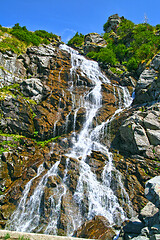 Image showing Summer waterfall in a rocky mountain