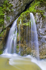 Image showing Mountain waterfall in a rocky mountain