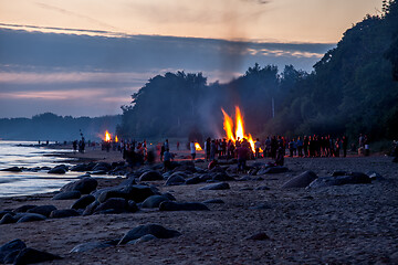 Image showing Unrecognisable people celebrating summer solstice with bonfires 