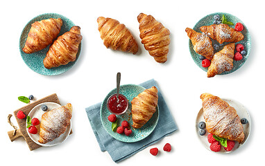 Image showing freshly baked croissant on blue plate