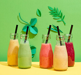 Image showing bottles of various colorful smoothies