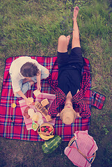 Image showing top view of couple enjoying picnic time