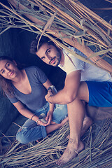 Image showing couple spending time together in straw tent