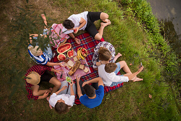 Image showing top view of group friends enjoying picnic time