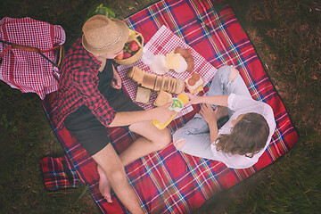 Image showing top view of couple enjoying picnic time