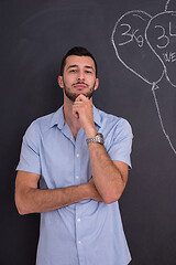 Image showing portrait of man in front of black chalkboard