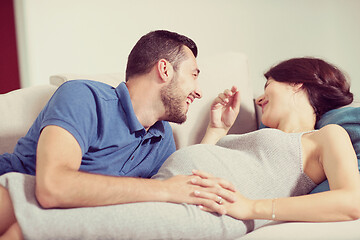 Image showing future dad listening the belly of his pregnant wife