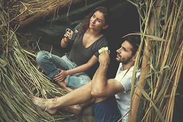 Image showing couple spending time together in straw tent