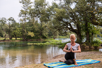 Image showing woman meditating and doing yoga exercise