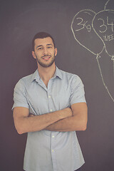 Image showing portrait of man in front of black chalkboard