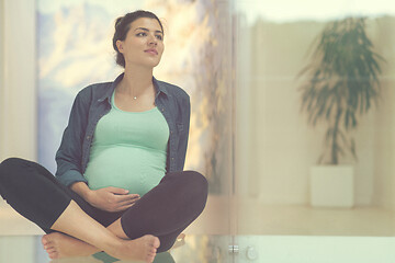 Image showing pregnant women sitting on the floor