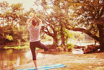 Image showing woman meditating and doing yoga exercise