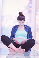 Image showing pregnant women sitting on the floor