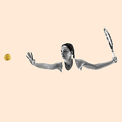 Image showing Portrait of young woman playing tennis isolated on studio background