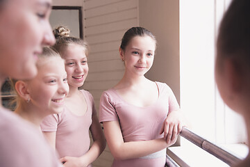 Image showing Young graceful female ballet dancers dancing at training studio
